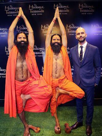Yog Rishi Swami Ramdev & Tiago Mogadouro, Head of Marketing, Madame Tussauds New York - Merlin Entertainments at the unveiling of Wax Figure of India’s most famous Yogic Guru - Swami Ramdev